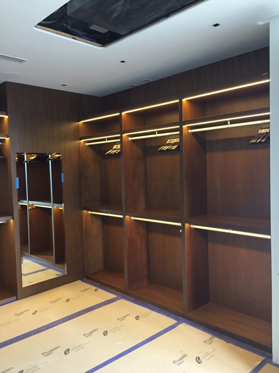 Luxury Dressing Room with Walnut Finish and Integrated Lighting